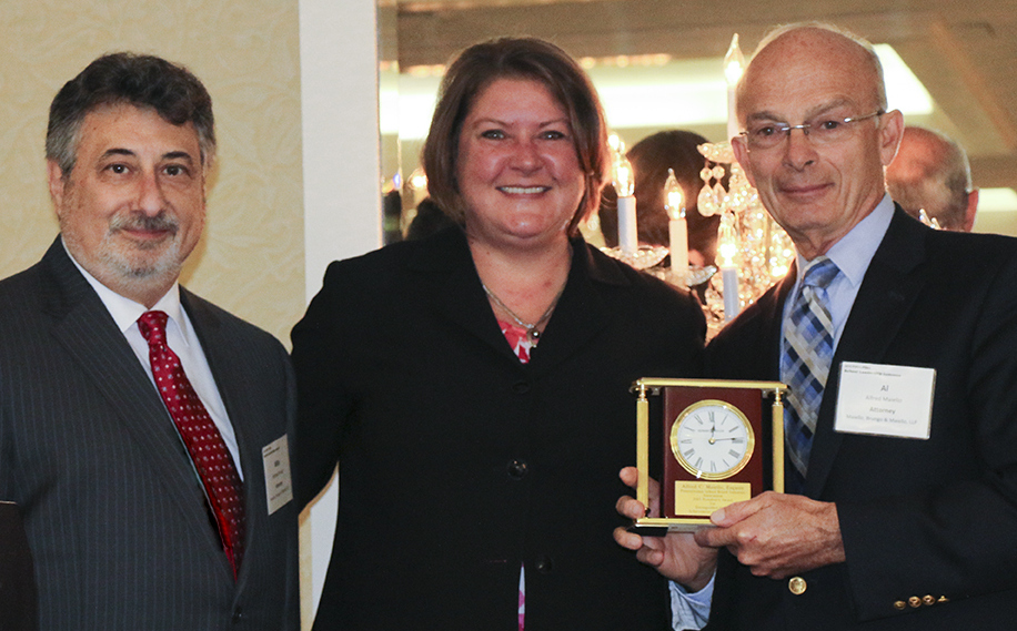 Al Maiello receiving his award. Pictured: (left to right) Mike Brungo, Kristine Roddick and Al Maiello